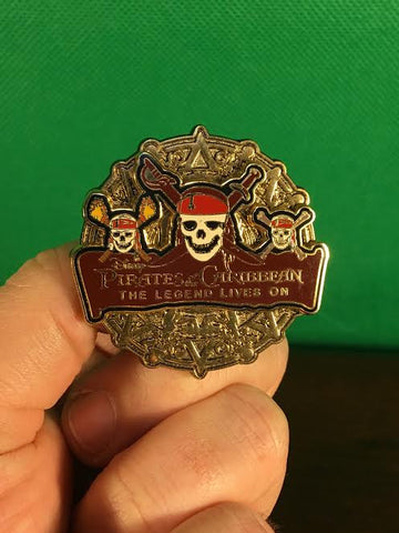 WALT DISNEY -- OFFICIAL PIRATES OF THE CARIBBEAN THE LEGEND LIVES ON SKELETON SKULL COIN TRADING PIN 59576